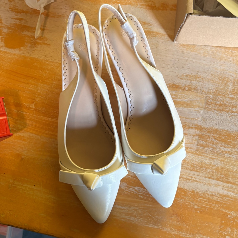 Size 8 womens New still in the box. Elegant Cream Slingback Heels